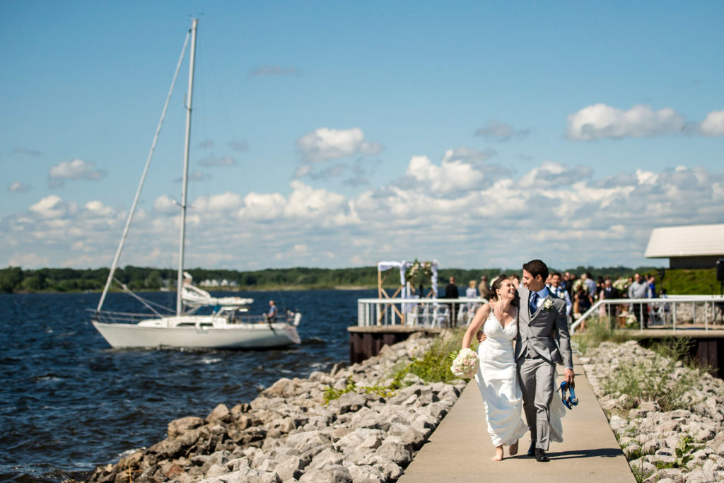 Newlywed Bride and Groom walk off Terrace Point in Muskegon, Michigan.